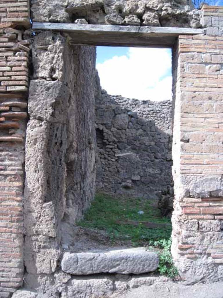 I.2.26 and I.2.25 Pompeii. December 2006. Entrance to steps to upper floor (on left).