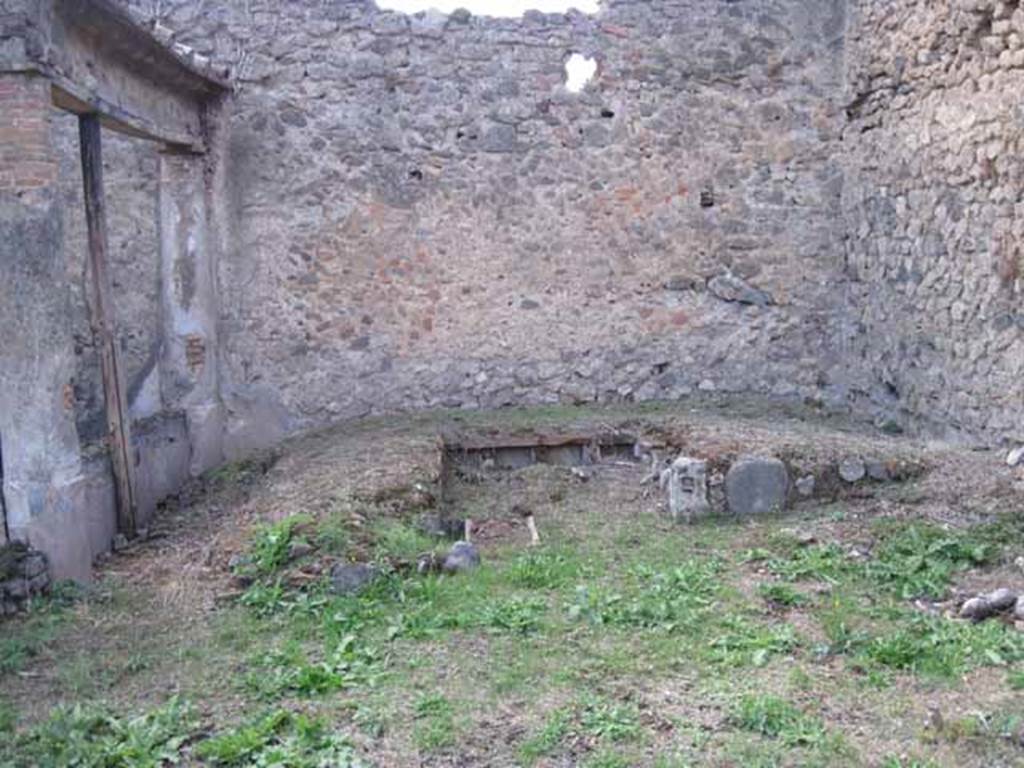 I.2.28 Pompeii. September 2010. Looking west across garden area towards triclinium area. Photo courtesy of Drew Baker.
According to Jashemski, the triclinium built against the west wall had a circular table. There were four niches in the inside of each couch. 
In the south couch, the last niche, which was of larger size, was separated from the other three by the mouth of the cistern. 
Along the north wall there was a small masonry podium which was reached by steps.   Opposite the lectus summus was a round tufa altar.
See Jashemski, W. F., 1993. The Gardens of Pompeii, Volume II: Appendices. New York: Caratzas. (p.25)
