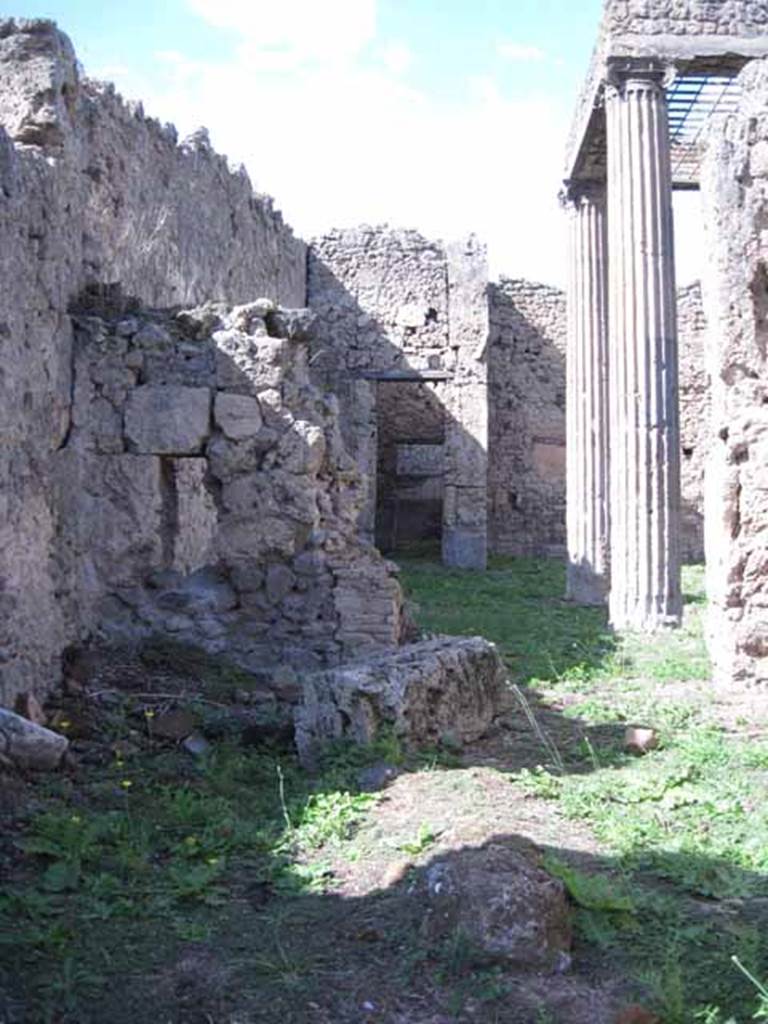 I.2.29 Pompeii. September 2010. Looking north from entrance doorway towards north wall that had a doorway into the atrium of I.2.28. 
Photo courtesy of Drew Baker.  The decorative serving table, counter or podium would have been on the left and centre of the photo. 
According to Garcia y Garcia, this bar was destroyed completely by a bomb. The perimeter walls have been reconstructed, but the three steps to the entrance, the sales counter and the electoral inscriptions have been lost forever. See Garcia y Garcia, L., 2006. Danni di guerra a Pompei. Rome: LErma di Bretschneider. (p.37)
