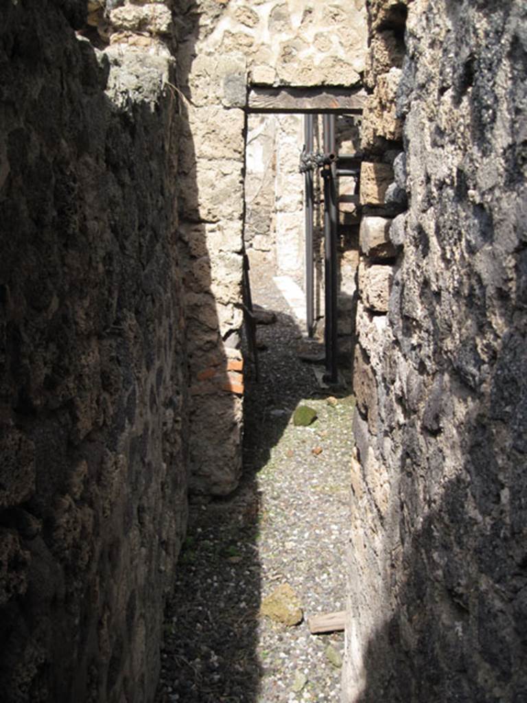 I.3.3 Pompeii. September 2010. Looking north along narrow area of corridor or latrine. Photo courtesy of Drew Baker.