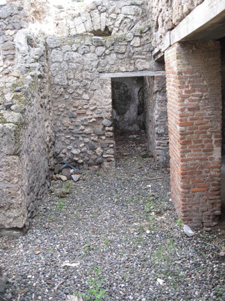 I.3.3 Pompeii. September 2010. Looking east across area of wider corridor, from north end of narrow corridor. On the left can be seen the doorway to the second triclinium, ahead is a doorway to an area that Fiorelli called “il repositorio”. On the right are the two doorways to the kitchen area.  Photo courtesy of Drew Baker

