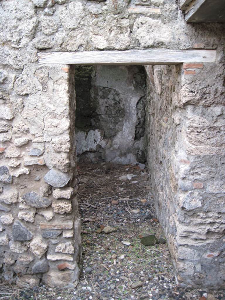 I.3.3 Pompeii. September 2010. Looking east towards doorway into small room, possibly il repositorio as described by Fiorelli. Photo courtesy of Drew Baker.
