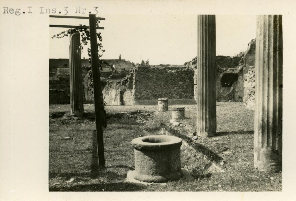 I.3.3 Pompeii. 1935 photograph taken by Tatiana Warscher, taken from the south.
Looking north along the west portico of the peristyle. See Warscher, T, 1935: Codex Topographicus Pompejanus, Regio I, 3: (no.6), Rome, DAIR, whose copyright it remains.  
According to Warscher, quoting Mau in Bull. Inst. 1874, p. 182, she wrote that 
“Il pavimento del peristilio è di mattoni pesti (opus Signinum) con pietruzze bianche poste in file, che fra le colonne formano una spezie di disegno” – (adesso distrutto).
(translation: "The floor of the peristyle was made of crushed brick (opus Signinum) with white stones laid in rows, these formed a type of design between the columns." – (now destroyed).
