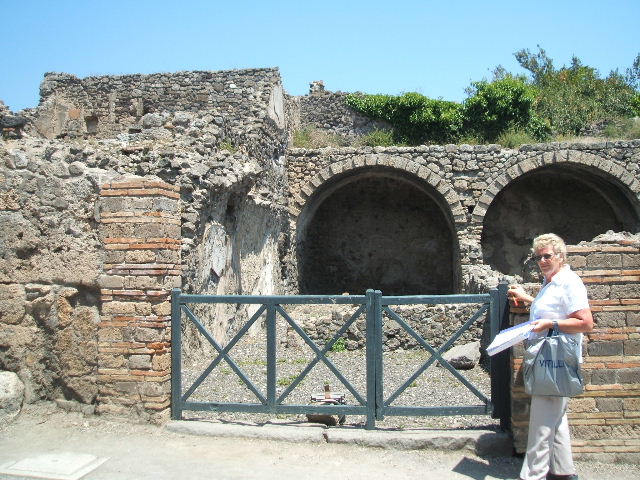 I.3.6 Pompeii. September 2010. Feature on pavement on north side of entrance doorway. Looking north along Via Stabiana, on left. Photo courtesy of Drew Baker.
