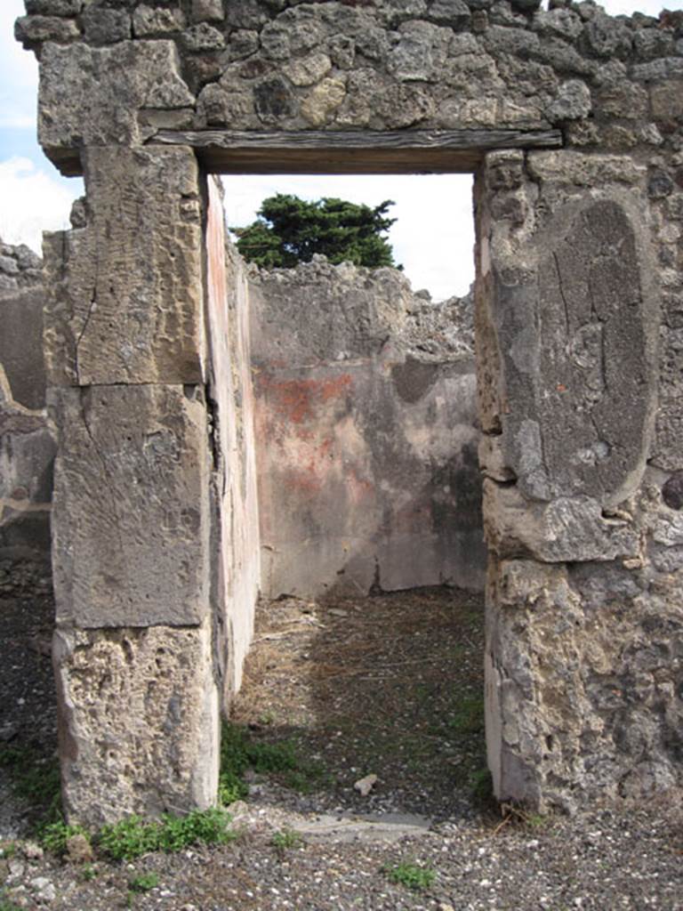 I.3.8b Pompeii. September 2010. Looking east through southern doorway in east wall of tablinum, into a cubiculum. Photo courtesy of Drew Baker.
