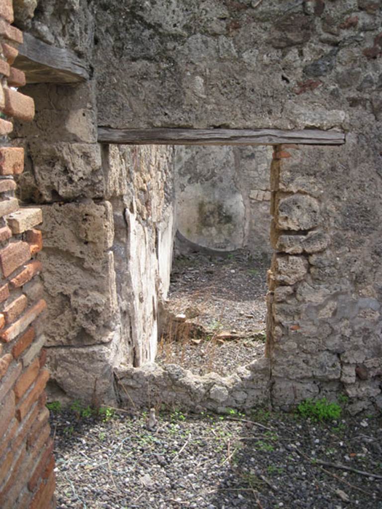 I.3.8b Pompeii. September 2010. Partially blocked doorway, or remains of a window in south wall of corridor. Photo courtesy of Drew Baker.

