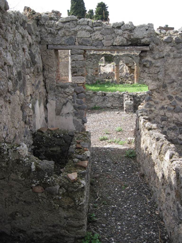 I.3.8b Pompeii. September 2010. Looking west from corridor, through south-central doorway towards east portico. Photo courtesy of Drew Baker.

