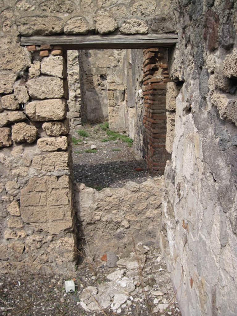 I.3.8b Pompeii. September 2010. North wall of cubiculum, showing reverse of blocked doorway or window aperture. Note difference in height of aperture. Photo courtesy of Drew Baker.


