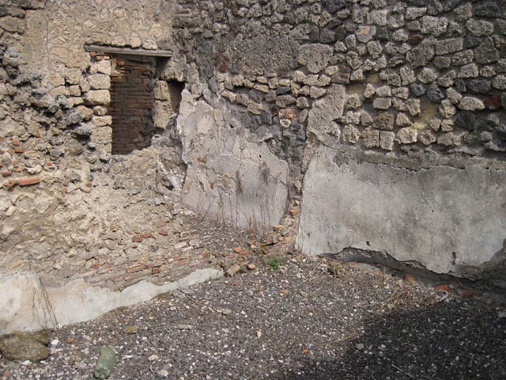 I.3.8b Pompeii. September 2010. Looking towards north-east corner, showing partition wall and blocked doorway or window aperture of cubiculum, in relationship to this room. Photo courtesy of Drew Baker.
