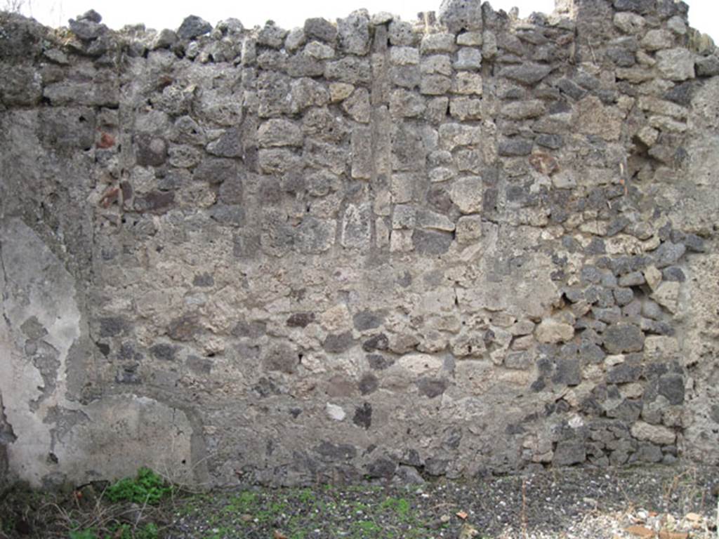 I.3.8b Pompeii. September 2010. West wall, note vertical slot features. Photo courtesy of Drew Baker.
