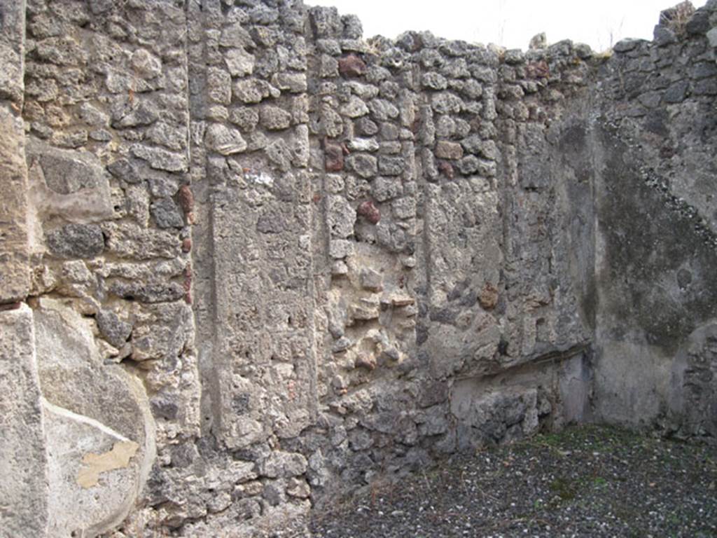 I.3.8b Pompeii. September 2010. East wall and south-east corner. Note vertical slot features corresponding to west wall of previous room, and couch recess. Photo courtesy of Drew Baker
