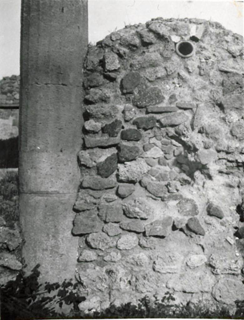 I.3.8b Pompeii. 1935 photograph taken by Tatiana Warscher. Looking east towards the rear of the oven, resting on the east portico. The terracotta pipe to lead the smoke to the exterior was embedded in the wall of the oven.
See Warscher, T, 1935: Codex Topographicus Pompejanus, Regio I, 3: (no.25), Rome, DAIR, whose copyright it remains.  

