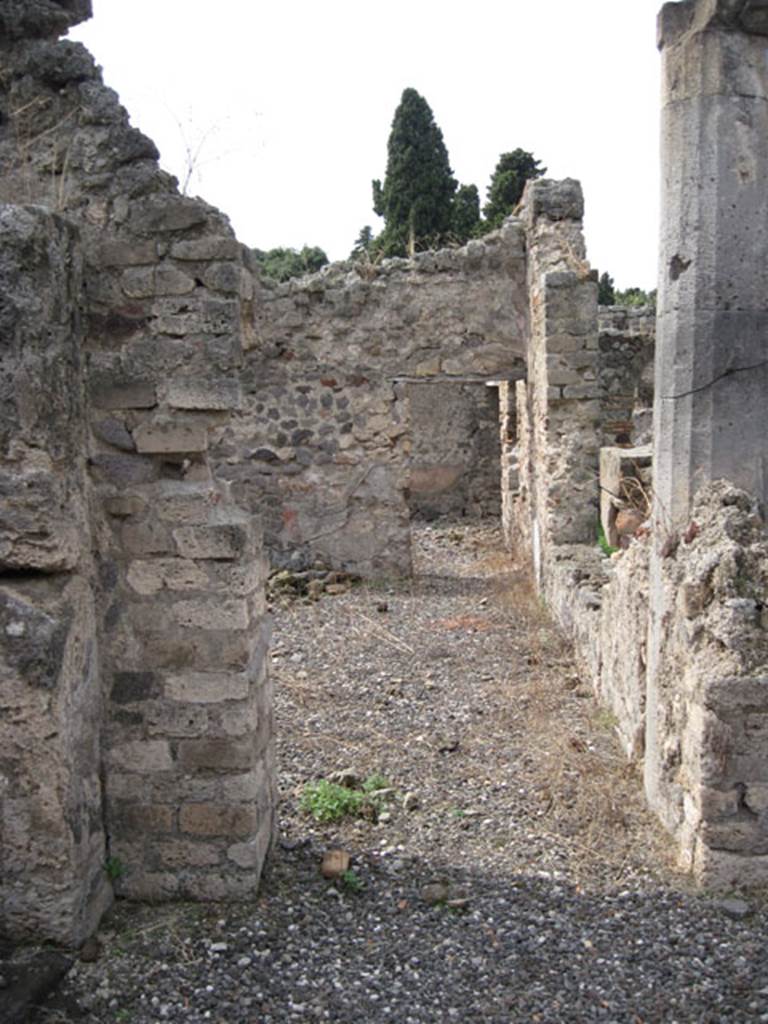 I.3.8b Pompeii. September 2010. Looking  into exedra with large window from garden area. Looking west along south portico, from south-east corner of peristyle. Photo courtesy of Drew Baker.
