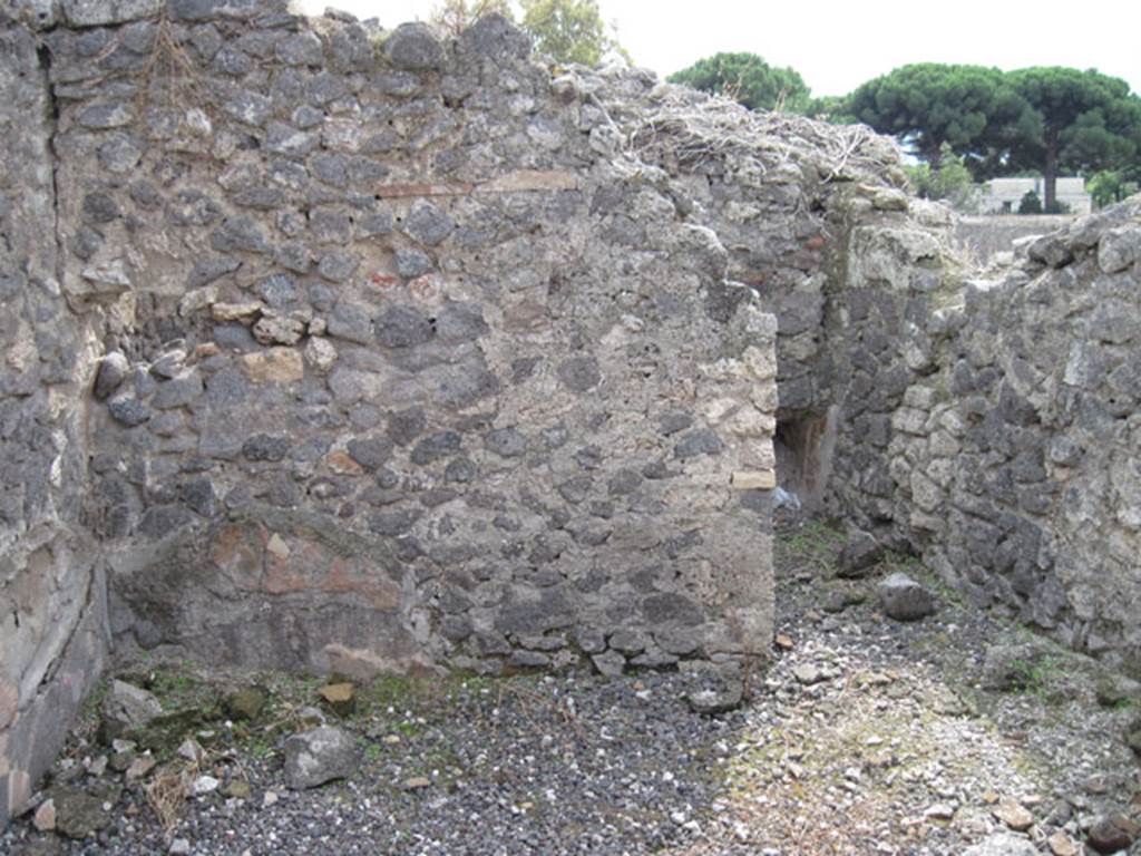 I.3.8b Pompeii. September 2010. South wall of oecus and doorway to a small room on south side. Photo courtesy of Drew Baker.
