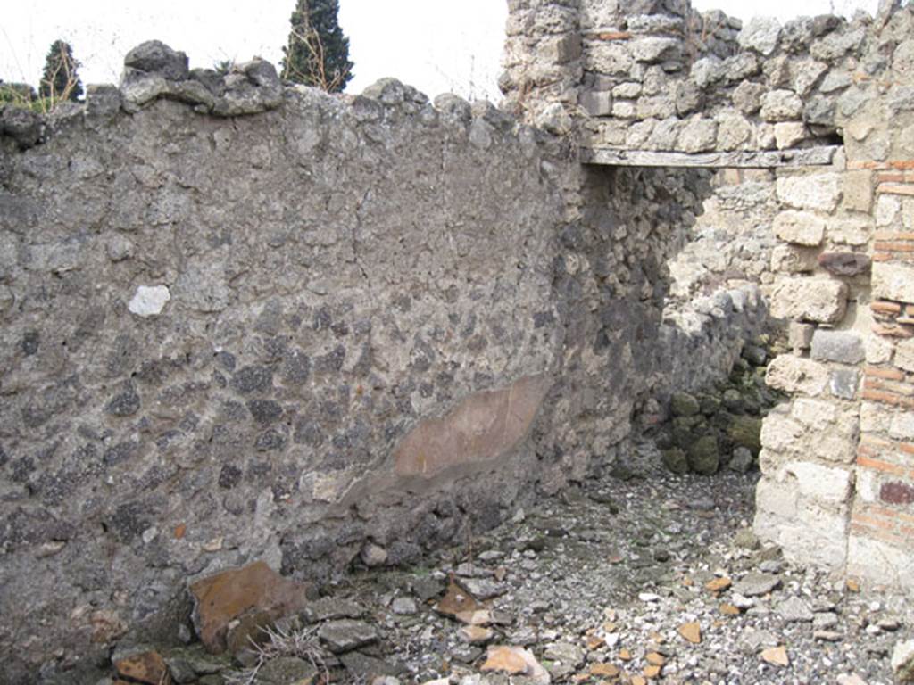 I.3.8b Pompeii. September 2010. West wall and north-west corner, with doorway to western portico of peristyle. Photo courtesy of Drew Baker.
