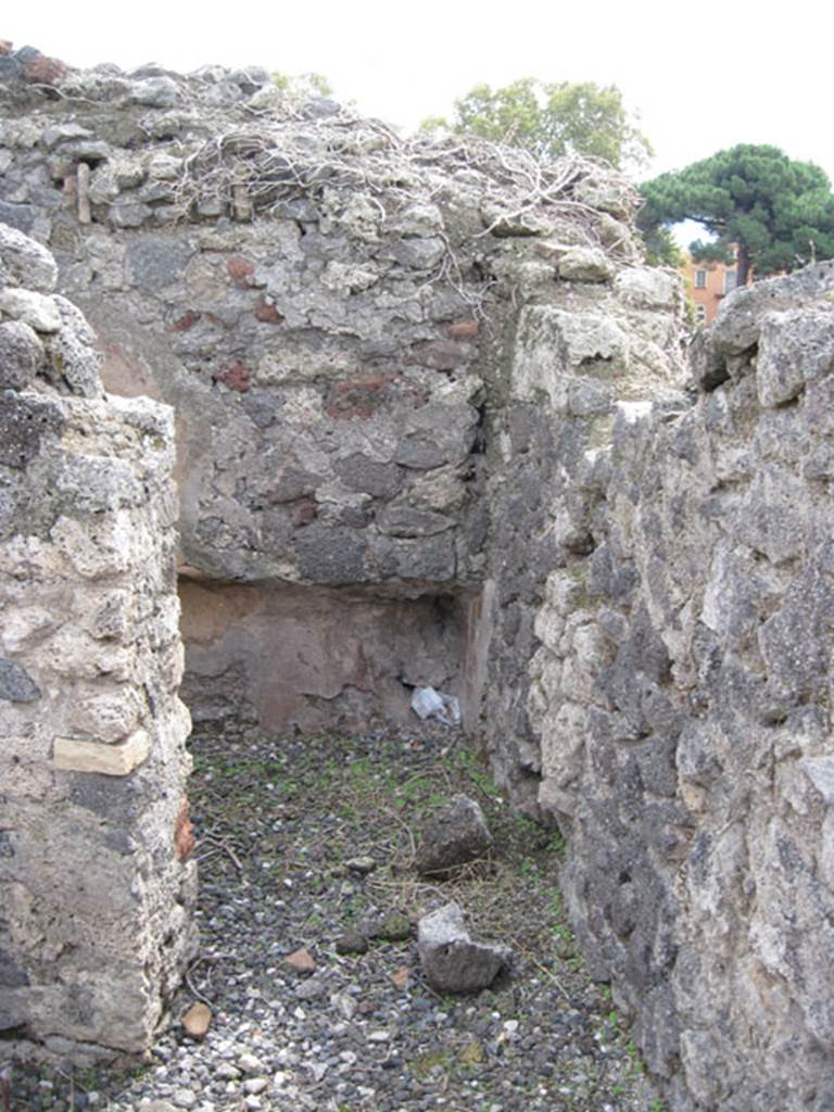 I.3.8b Pompeii. September 2010. Doorway in south wall leading to small room on south side of oecus in south-west corner. Fiorelli described this room, as a small repository, that in other times had been part of the oecus on its north side. Photo courtesy of Drew Baker.

