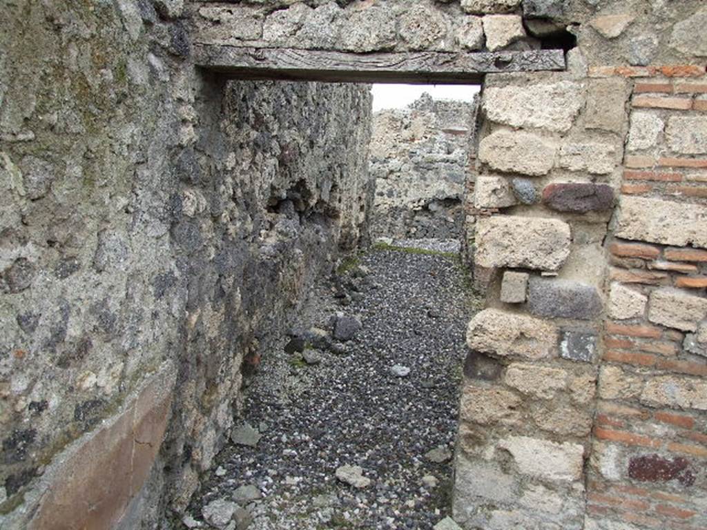 I.3.8b Pompeii. December 2006. Looking north along walkway behind arches on west side.