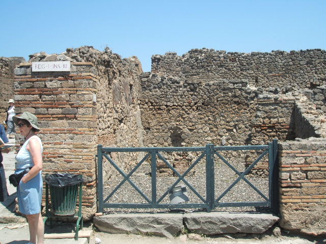 I.3.12 Pompeii.  Shop.  North wall and rear room in north east corner.