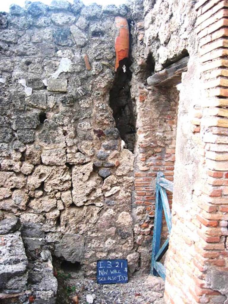 I.3.21 Pompeii. July 2008. Looking towards north wall, with downpipe. Photo courtesy of Barry Hobson.
