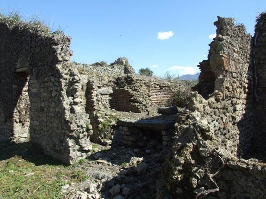 I.3.27 Pompeii. March 2009. Looking south-east towards remains of oven on south side of bakery room. 