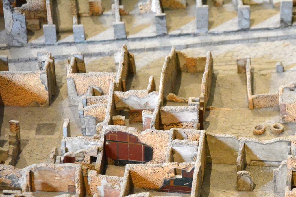 I.4.9 Pompeii. May 2019. Detail from model in Naples Archaeological Museum.
Triclinium/oecus m, according to the model, the west wall of the triclinium, painted black/red, is shown in the lower centre.
Foto Tobias Busen, ERC Grant 681269 DCOR.
