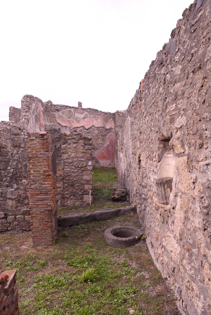 I.4.9 Pompeii. October 2019. 
Courtyard n, looking north towards cistern-mouth in floor, and niche in east wall.
Foto Tobias Busen, ERC Grant 681269 DCOR.
