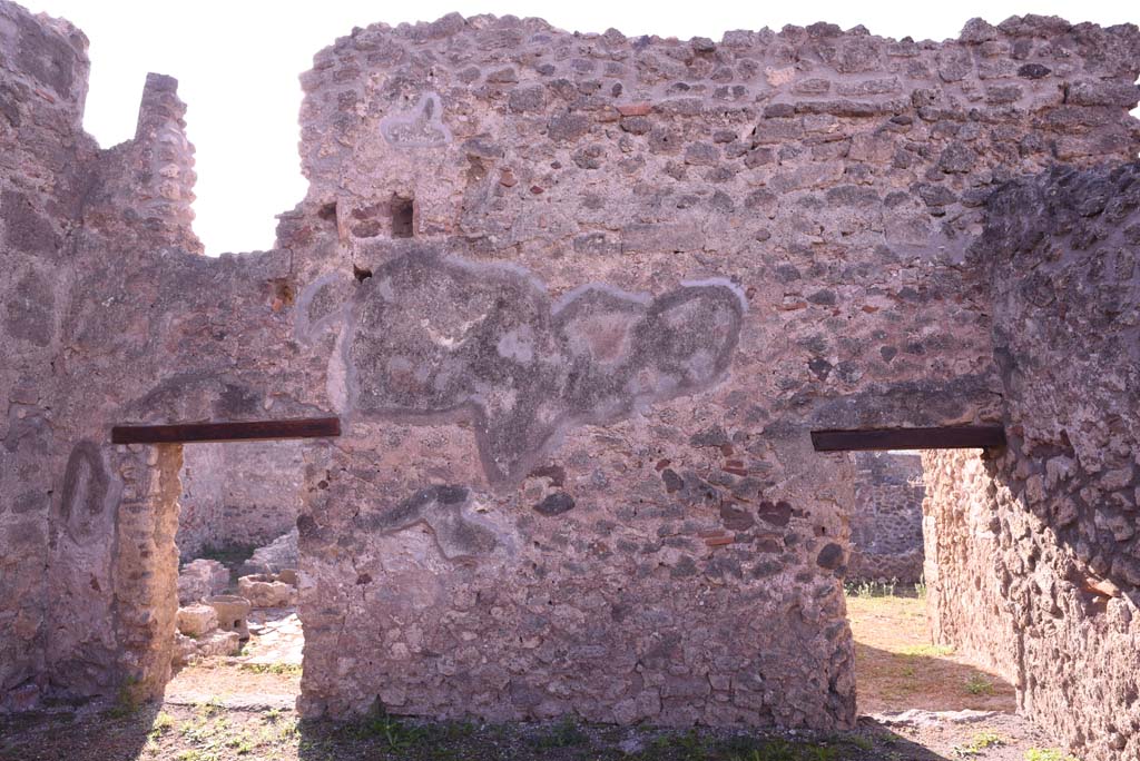 I.4.17 Pompeii. October 2019. 
Looking towards south wall of shop-room, with doorway to I.4.12, on left, and door to I.4.13, on right.
The doorway on the left leads into room h of I.4.12 and can be seen on the page for that number.
The doorway on the right leads into room b of I.4.13 and can be seen on that number.
Foto Tobias Busen, ERC Grant 681269 DCOR.

