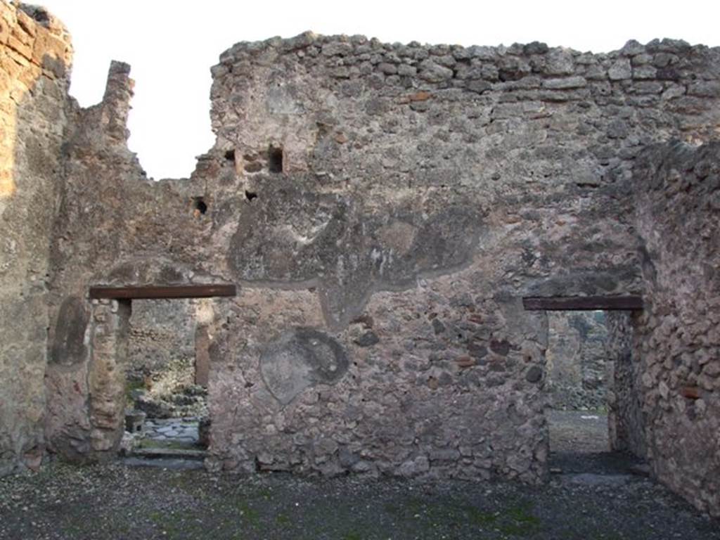 I.4.17 Pompeii. December 2007. South wall with doorway to I.4.12, on left, and door to I.4.13, on right.