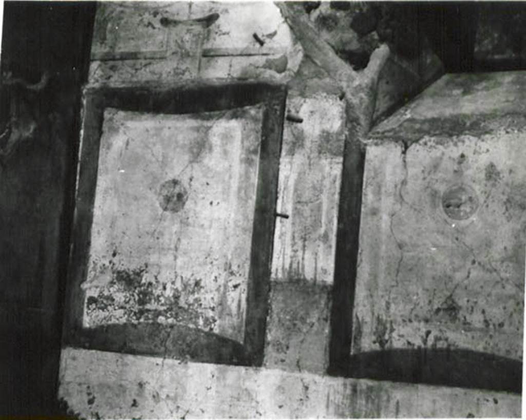 10502-warscher-codex-105-2-640.jpg
I.5.2 Pompeii. 1936, taken by Tatiana Warscher. Painted panels on north wall of small room with window onto Vicolo del Conciapelle. See Warscher T., 1936. Codex Topographicus Pompeianus: Regio I.1, I.5. Rome: DAIR, whose copyright it remains.
Warscher, quoting Giorn.Sc.III, 1874, no.21, A. Sogliano, p.8/9, describef this small room as probably an oecus, “room f” with flooring of mattone pesto, its wall painted yellow.
The wall at the rear (north wall) had in its centre a small landscape nearly vanished, and the others each offered a painting of a bird.

