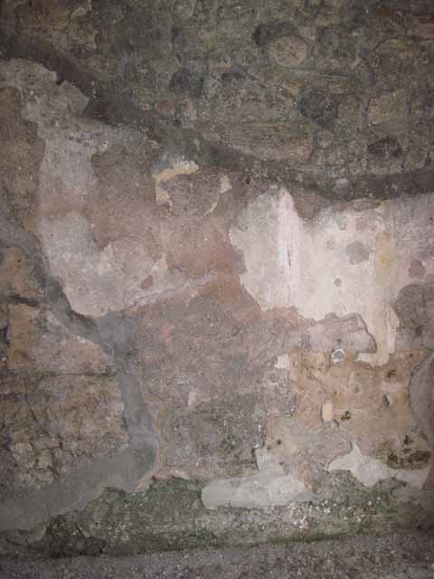 I.5.2 Pompeii. September 2010. East wall of small room, centre with fresco work. Photo courtesy of Drew Baker.
