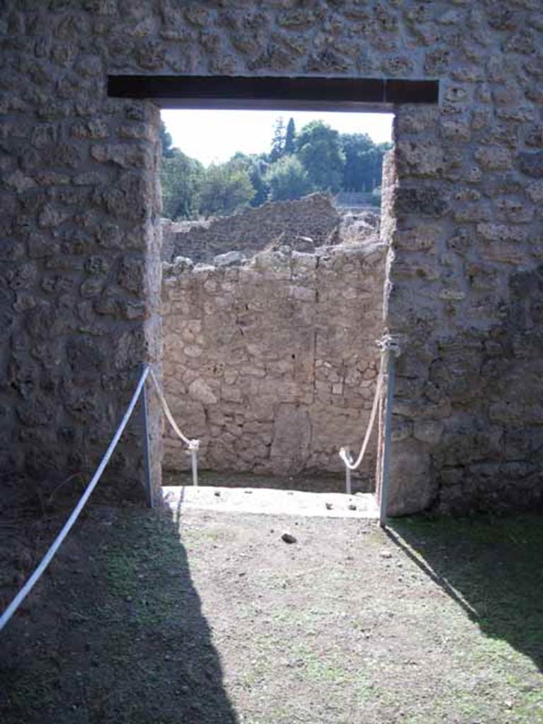 I.5.2 Pompeii. September 2010. Looking west from back room with fifteen vats towards doorway and steps down. Photo courtesy of Drew Baker.
