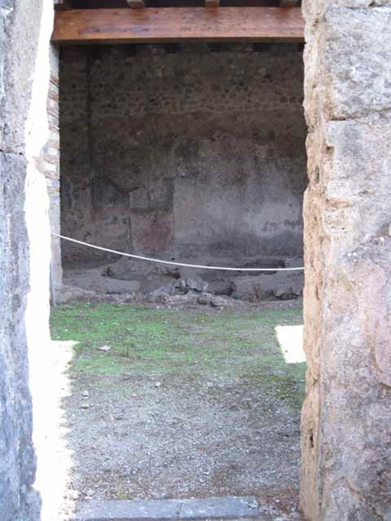 10502%20Baker%20Picture%20205
I.5.2 Pompeii. September 2010. Looking south through doorway from room on west side of north end, towards industrial room. Photo courtesy of Drew Baker.
