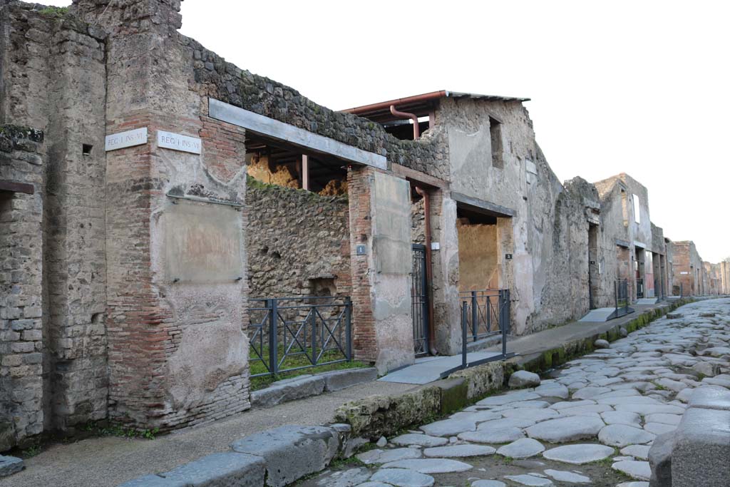I.6.1 Pompeii. December 2018. 
Looking west on south side of Via dellAbbondanza, between I.6.1 and I.6.12. Photo courtesy of Aude Durand.

