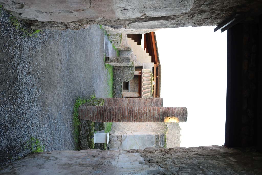 I.6.2 Pompeii. May 2006. Rooms on the east side. Looking south along passage between the atrium and the peristyle garden. Two bombs fell on the house on the 19th September 1943. These rooms, the eastern ala and the next four rooms together with the eastern perimeter wall were destroyed. See Garcia y Garcia, L., 2006. Danni di guerra a Pompei. Rome: L’Erma di Bretschneider. (p. 41).