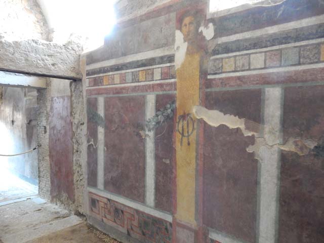 I.6.2 Pompeii. December 2007. West end of south wall of frigidarium, with painting of satyr pouring wine.
