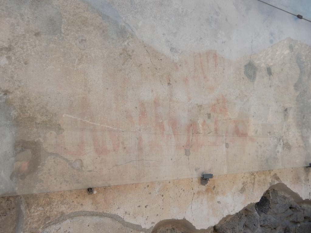 I.6.15 Pompeii. June 2019. Detail of graffiti on west side of entrance doorway. Photo courtesy of Buzz Ferebee.