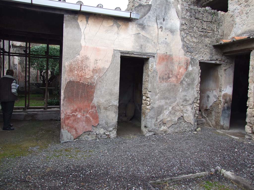 I.7.7 Pompeii. December 2006. Atrium and rooms on the west side, doorways to ala, cubiculum, stairs and triclinium.