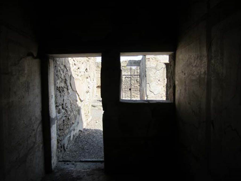 I.7.11 Pompeii. March 2012. Looking towards doorway and window in east wall of bedroom, on west side of atrium. Photo courtesy of Marina Fuxa.

