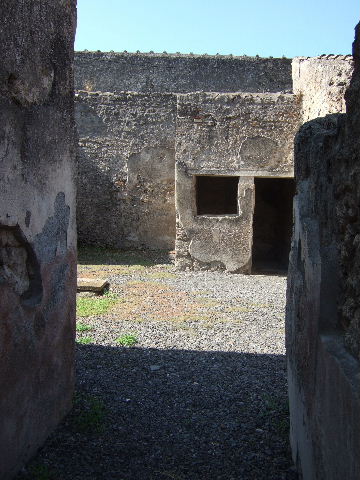 I.7.11 Pompeii. December 2006. Lararium painted flaming altar in the form of a metal brazier, with serpent on either side.