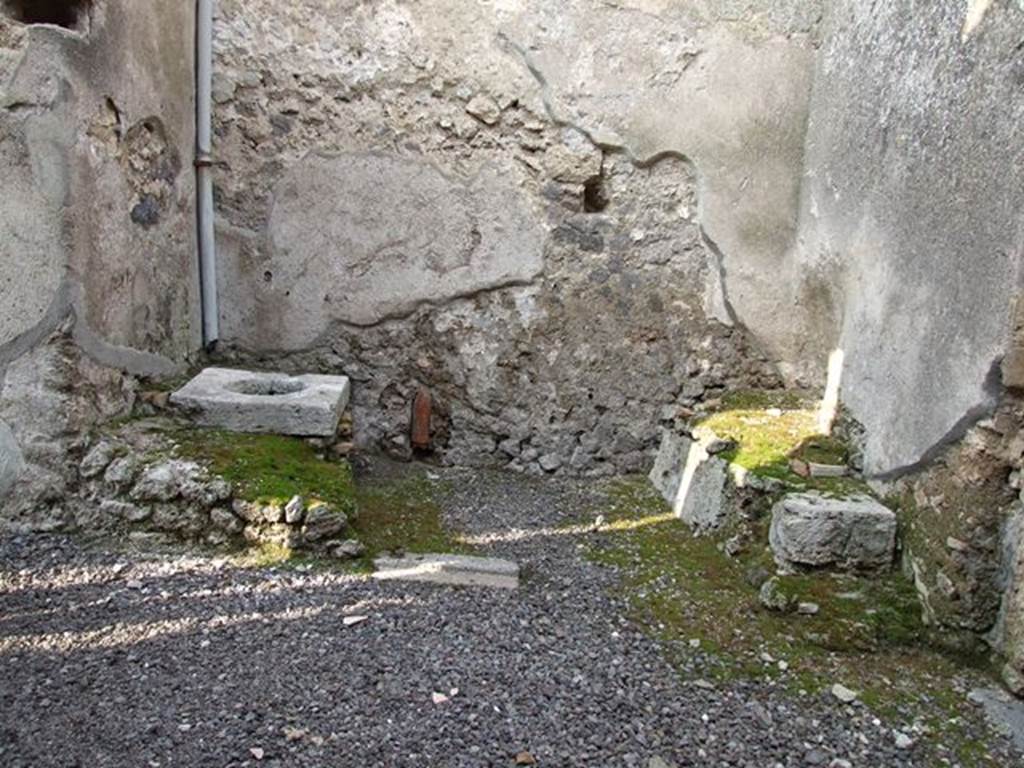 I.7.12 Pompeii. December 2006. Room or area to north of entrance I.7.12, with cistern mouth and steps to upper floor against east wall (on the right).
