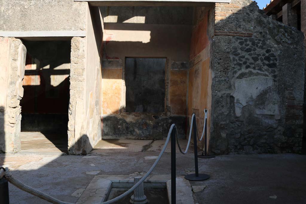 I.7.19 Pompeii. December 2018. Looking east across impluvium in atrium towards tablinum. Photo courtesy of Aude Durand.