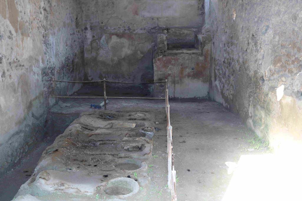 I.8.15 Pompeii. December 2018. Looking north across room with kiln and plant for production of pigments. Photo courtesy of Aude Durand.

