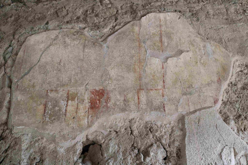 I.8.15Pompeii. December 2018. Remaining painted decoration on upper east wall, above niche. Photo courtesy of Aude Durand.