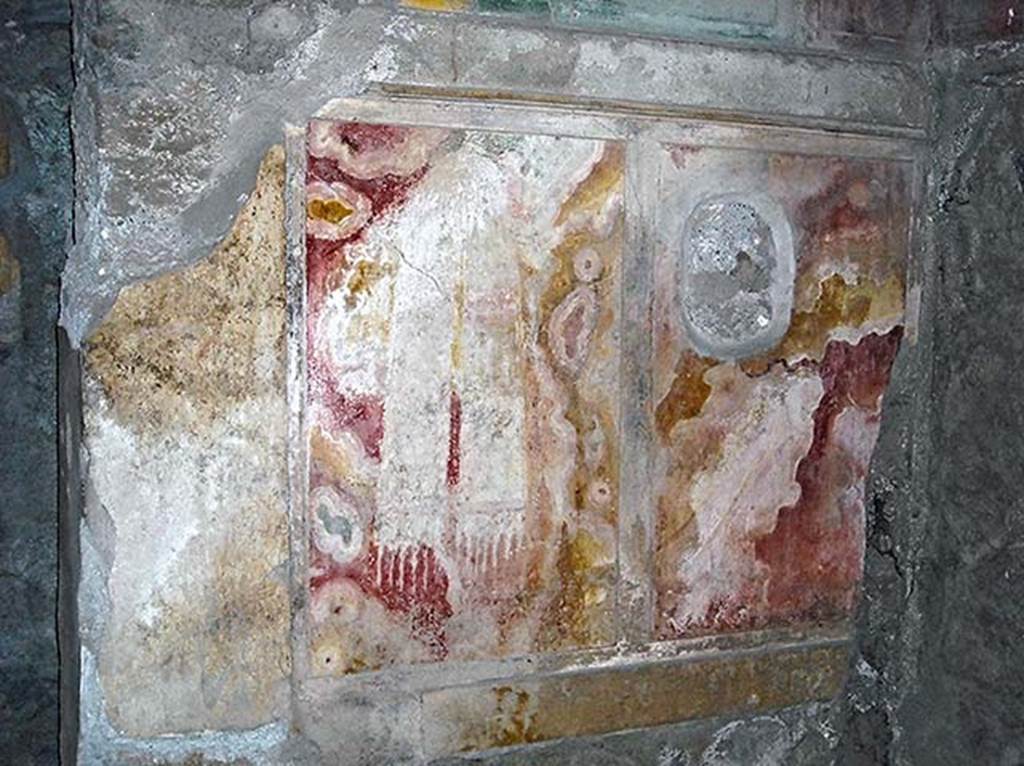 I.8.17 Pompeii. 2010. Room 15. West wall of alcove with detail of marbling with outline of towel or scarf.