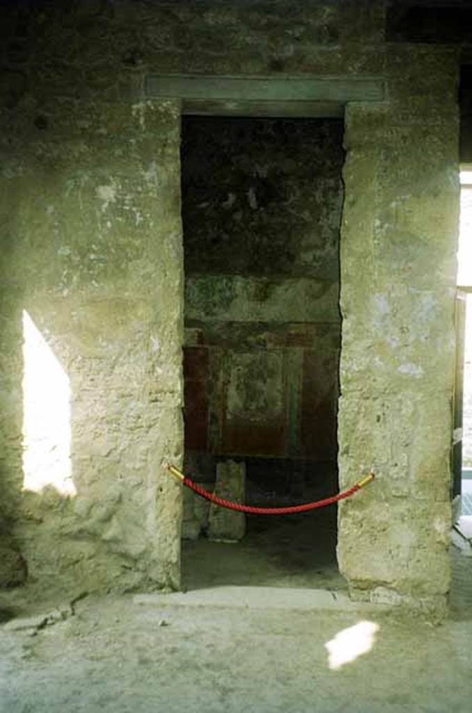 I.8.17 Pompeii. June 2010. Doorway to room 4, on south side of entrance corridor. Looking west. Photo courtesy of Rick Bauer.
