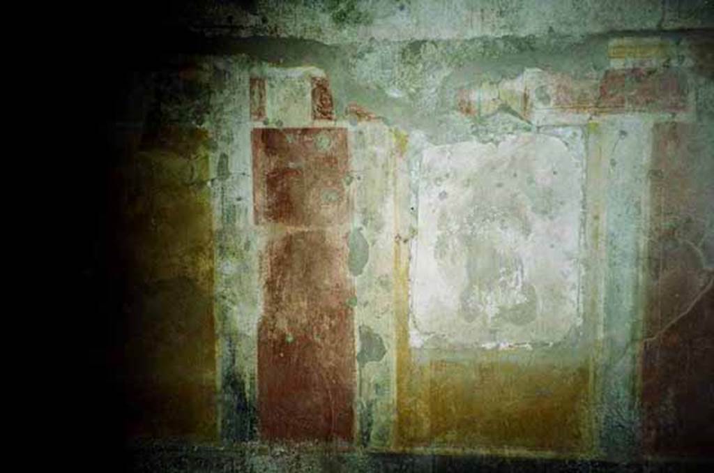I.8.17 Pompeii. June 2010. Room 4, west wall with painting of Maenad with thyrsus, in central panel. Photo courtesy of Rick Bauer.