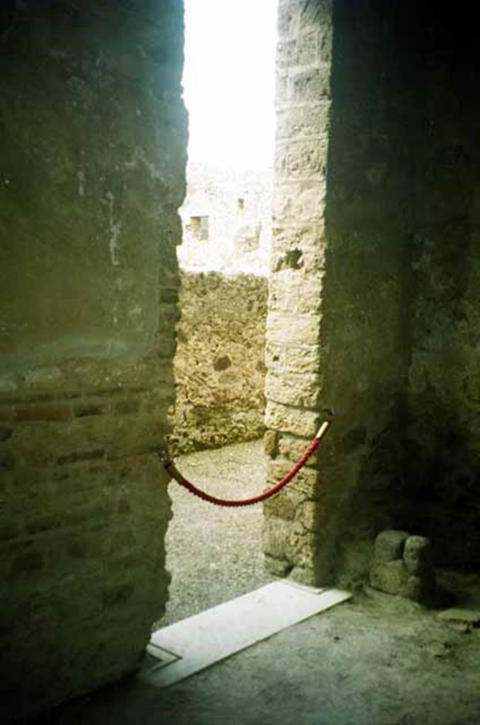 I.8.17 Pompeii. June 2010. 
Doorway, with travertine marble sill, to room 6, leading to room 5. 
Photo courtesy of Rick Bauer.


