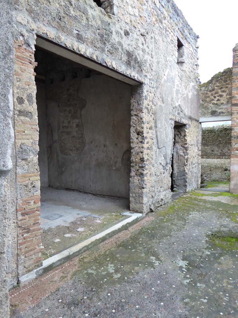 I.9.5 Pompeii. March 2009. East side of portico, with large doorway to room 13.