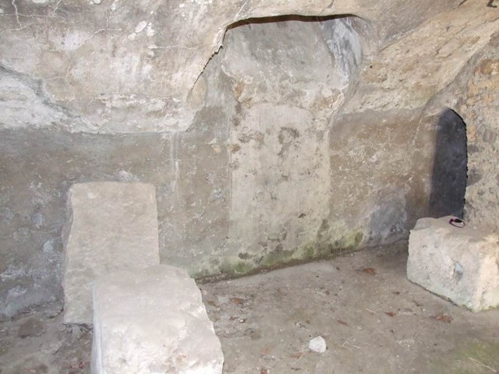 I.10.4 Pompeii.  March 2009.  Third Lower storeroom C.  East wall, with window or opening from corridor above.  The small doorway leads to the room containing the praefurnium, or boiler.