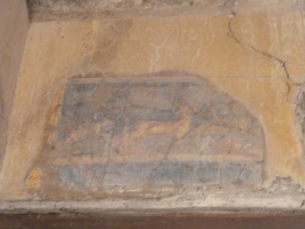I.10.4 Pompeii. September 2015.  Atrium, on the south wall above doorway to corridor 9.  Painting of a dog chasing a deer.
